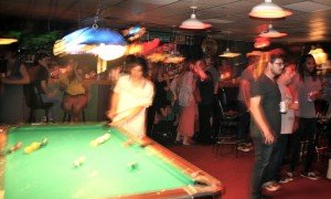 Trung Ngo, of TV Girl, shooting pool before their set